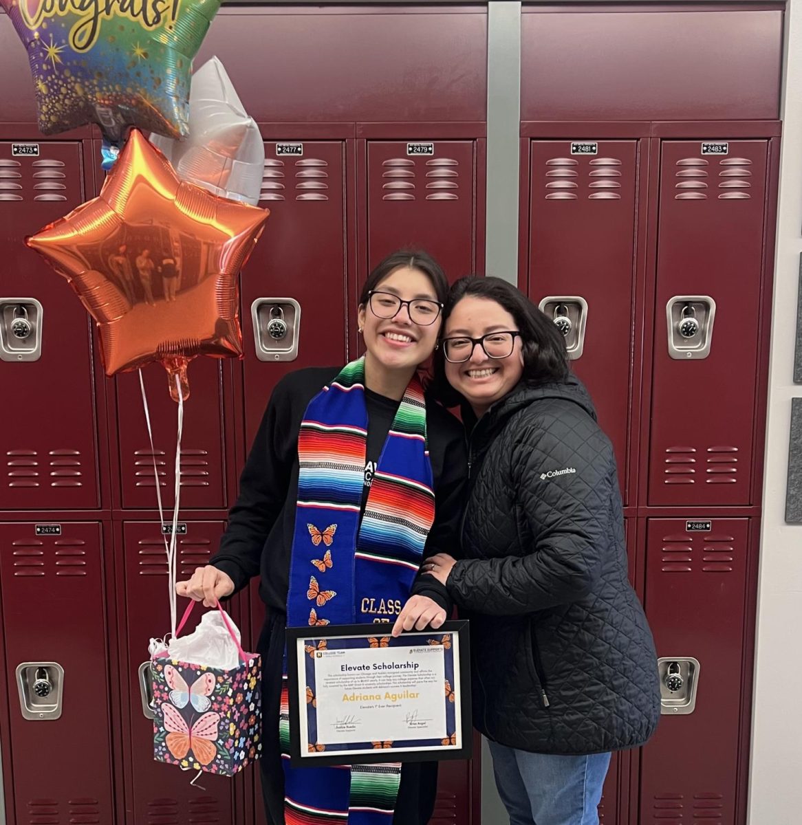 Senior Adriana Aguilar and her mother pose at Speer after receiving the scholarship.
